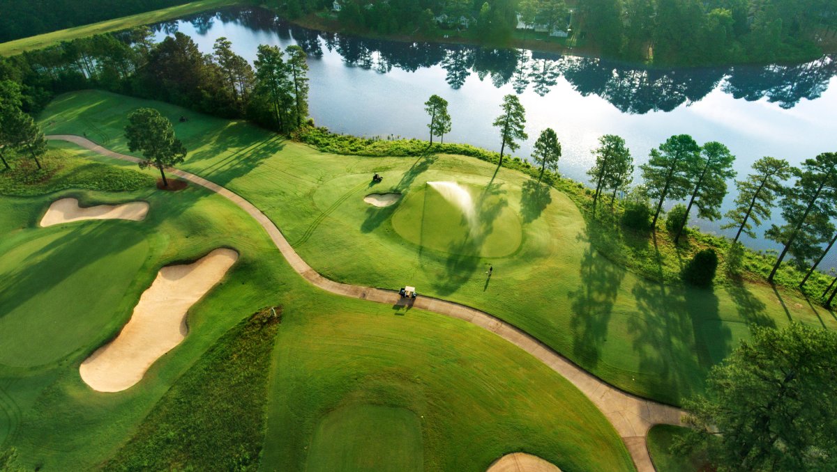 Aerial view of No. 8 at Pinehurst Resort with sand bunkers, cart path, greens and pond