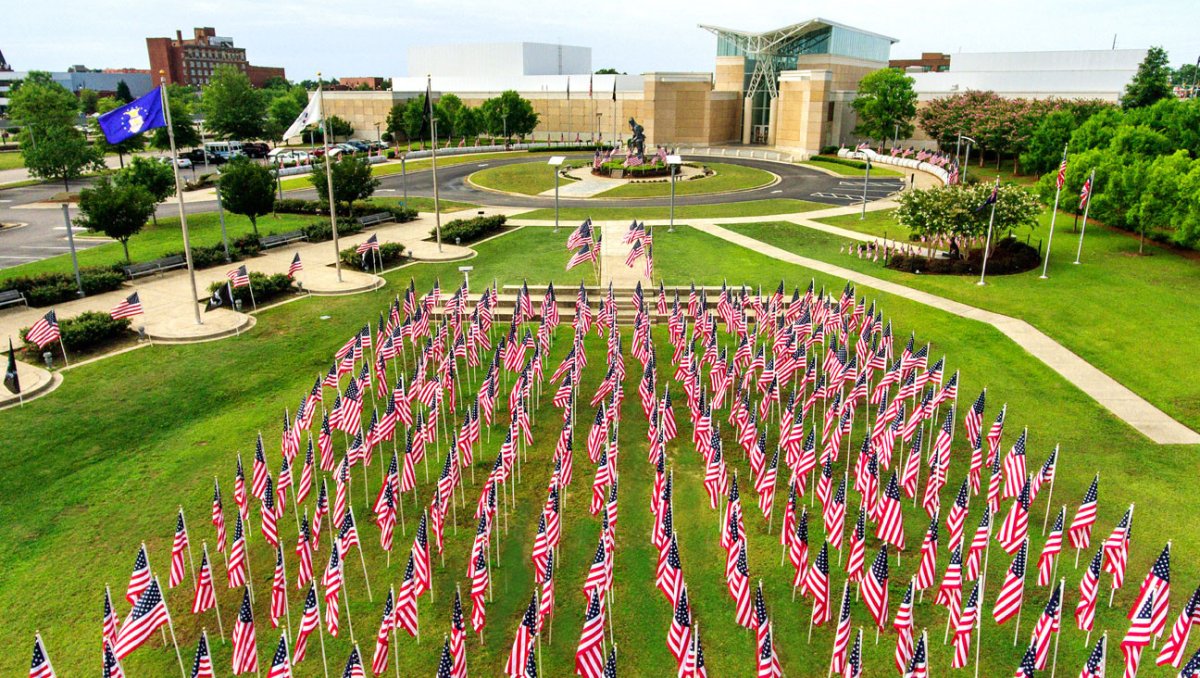 Aerial view of American flags in ground in front of museum