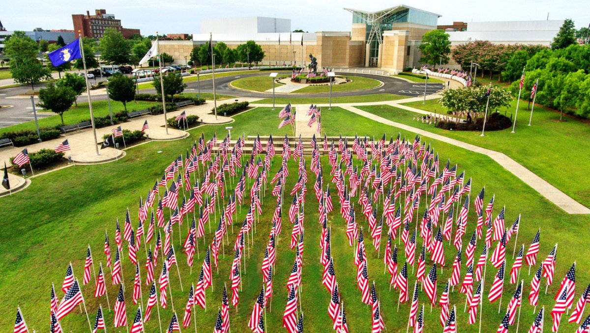 Aerial view of American flags in ground in front of museum