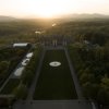 Aerial of vast Biltmore grounds and estate with mountains in background