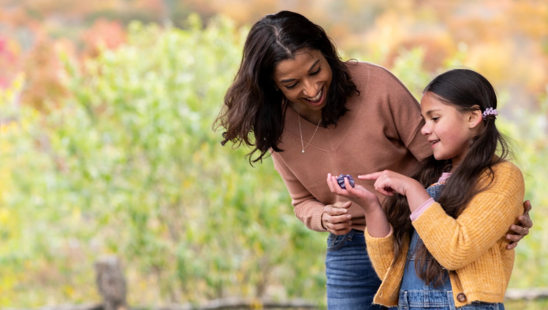 A person and a child looking at something