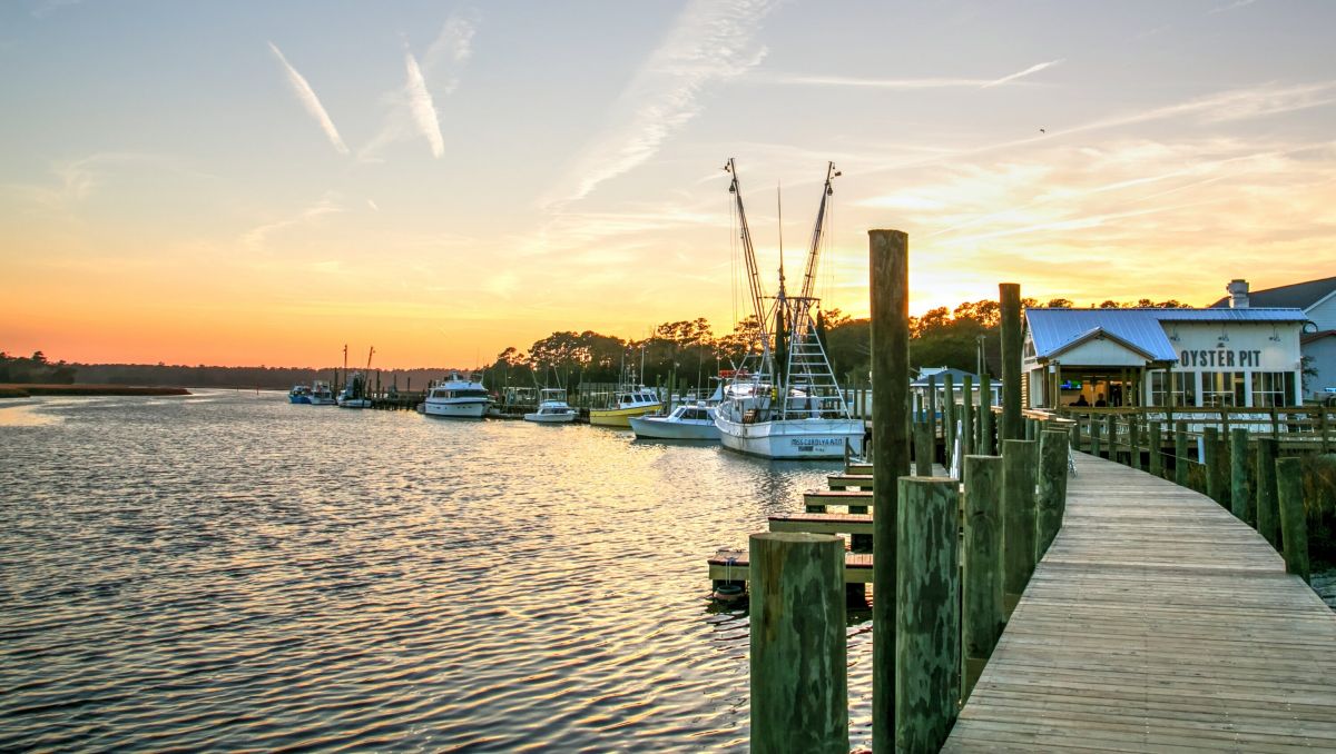 Boats on the Calabash Waterfront with sun setting