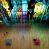 Aerial of people enjoying stained glass wall in art museum