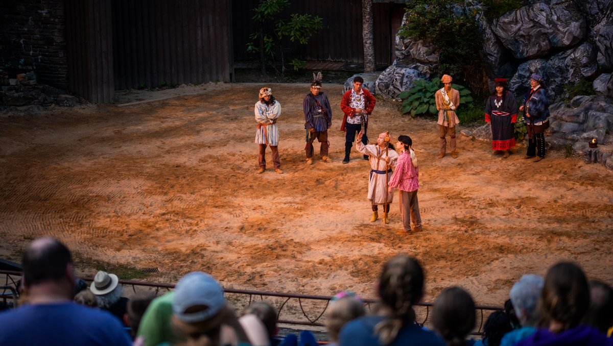 Audience in foreground watching performers during 