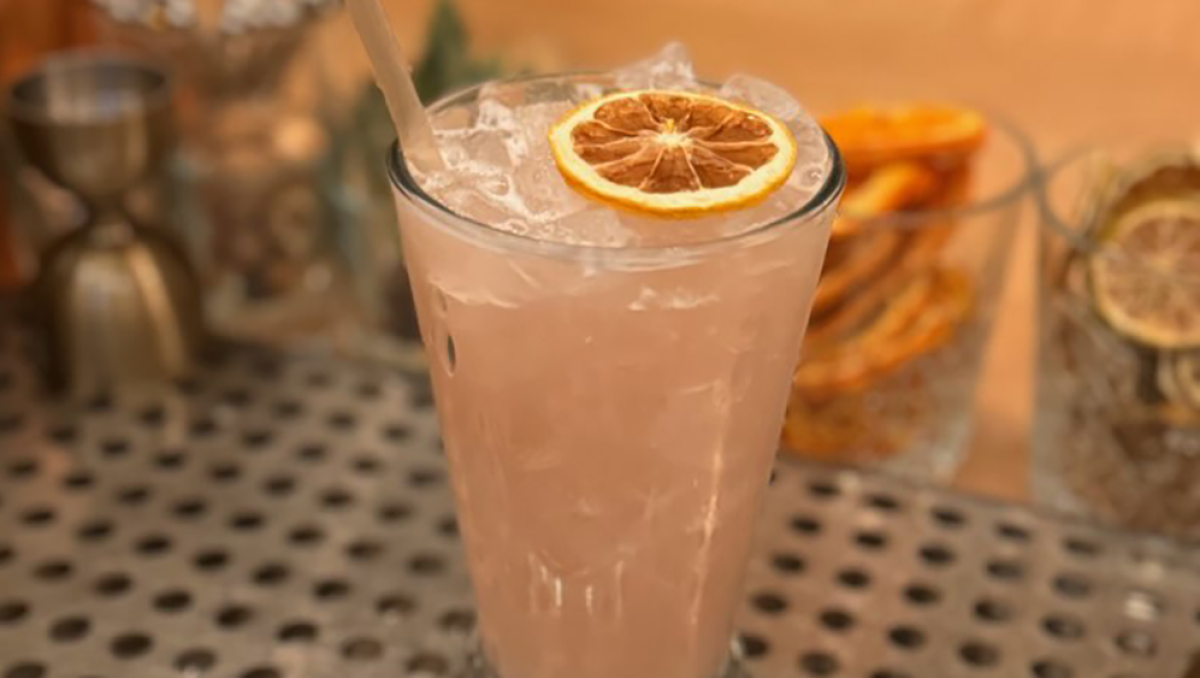 Closeup of orange vodka drink on bar