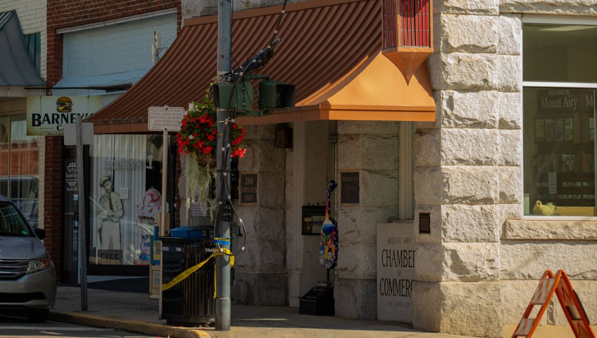 Downtown Mount Airy street corner with clock on building during daytime