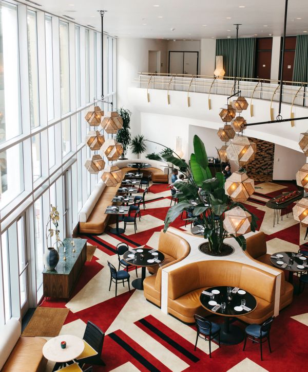 Aerial view of the Durham Hotel's restaurant with empty tables and fun light fixtures