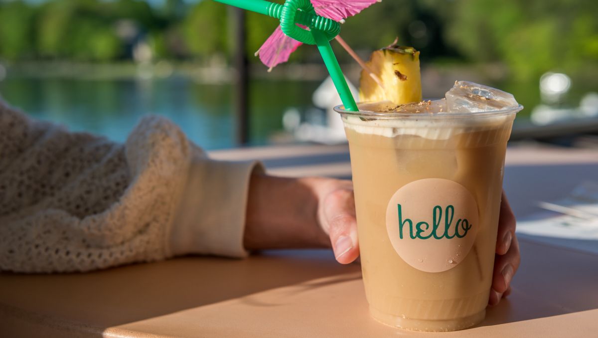 Woman's hand holding fun drink at Hello, Sailor on Lake Norman