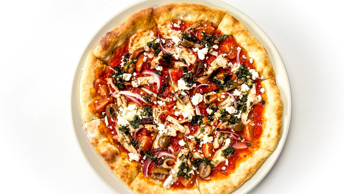 Overhead closeup of veggie pizza on plate