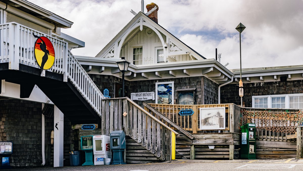 Exterior of the Black Pelican restaurant entrance on cloudy day