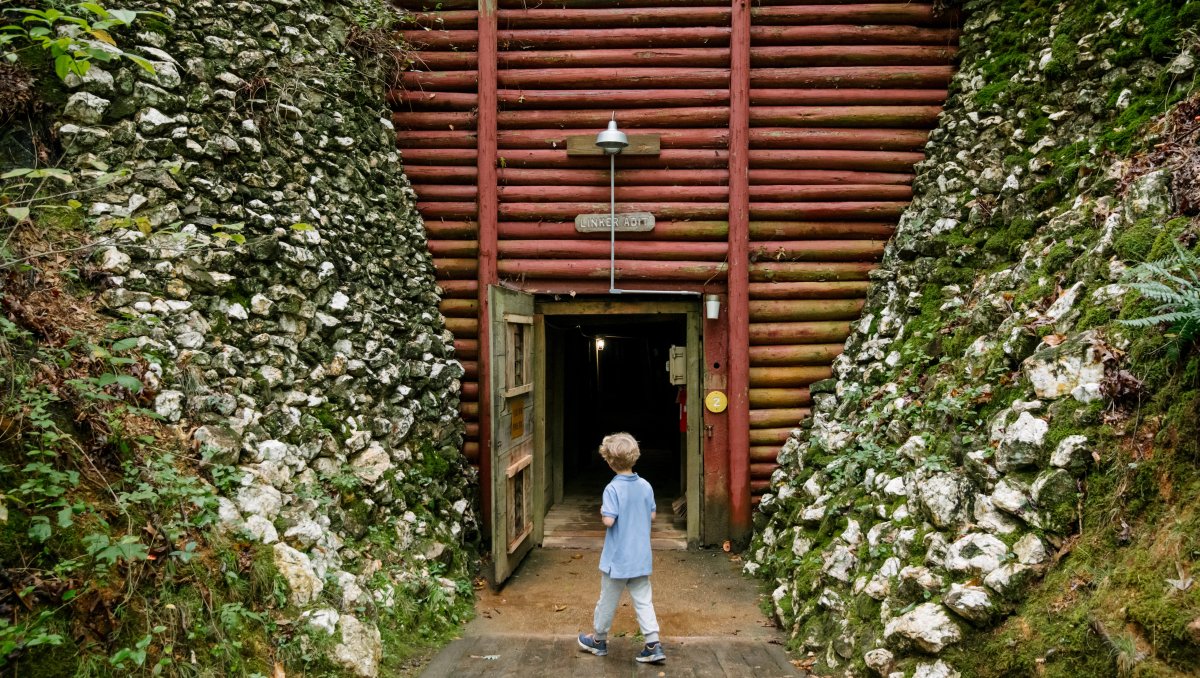 Child walking into gold mine tunnel underground