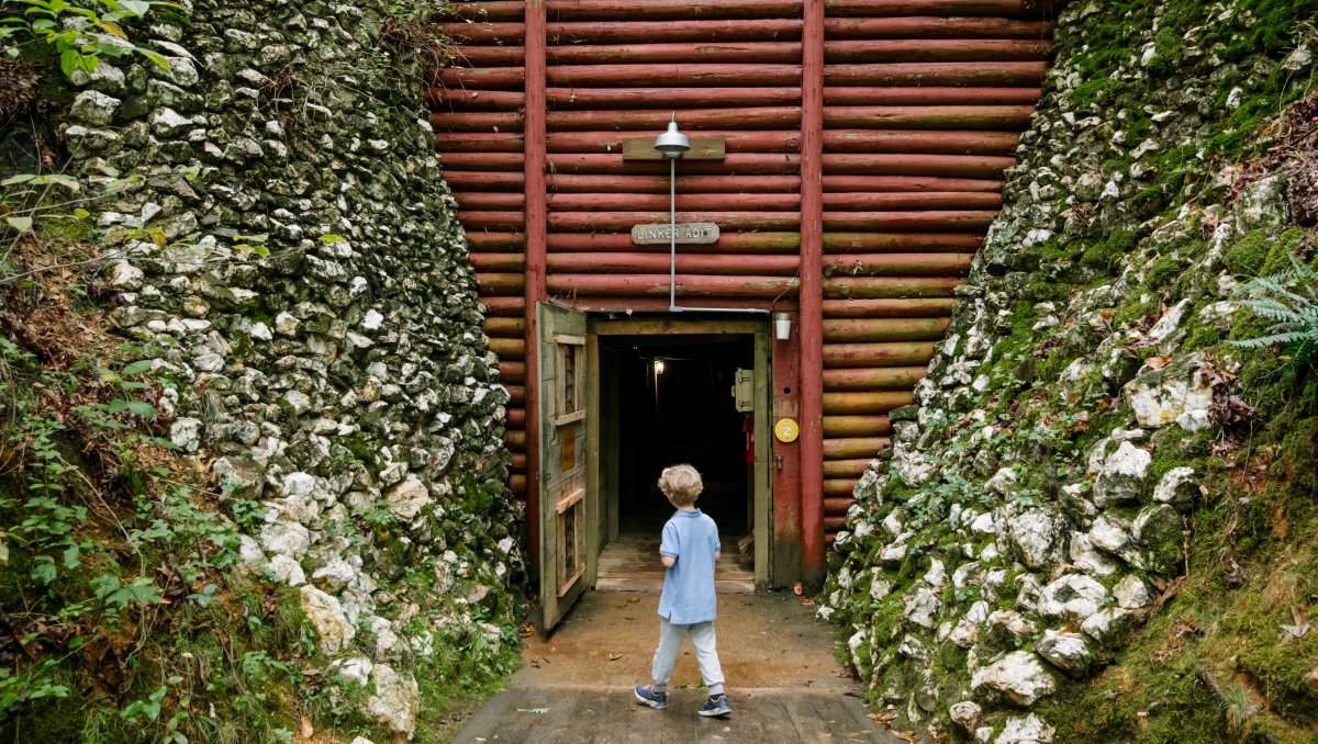 Child walking into gold mine tunnel underground