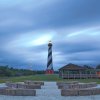 Long-range view of Cape Hatteras Lighthouse and grounds at dusk