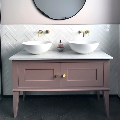 Pink vanity with tapered legs