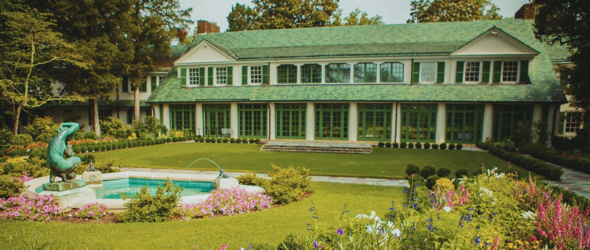 Reynolda House exterior in Winston-Salem with gardens and fountain in foreground